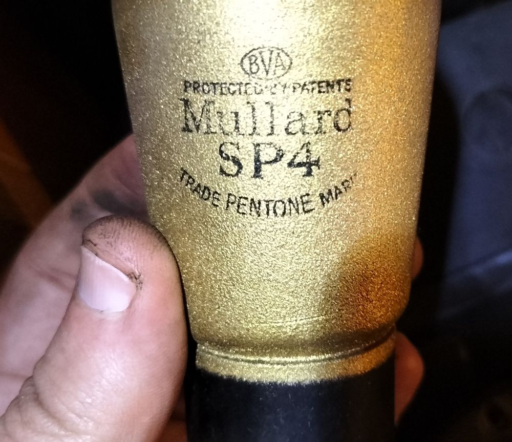 Some sort of valve. This one is coated in gold coloured paint, and had a wire screwed to a nub on the top.