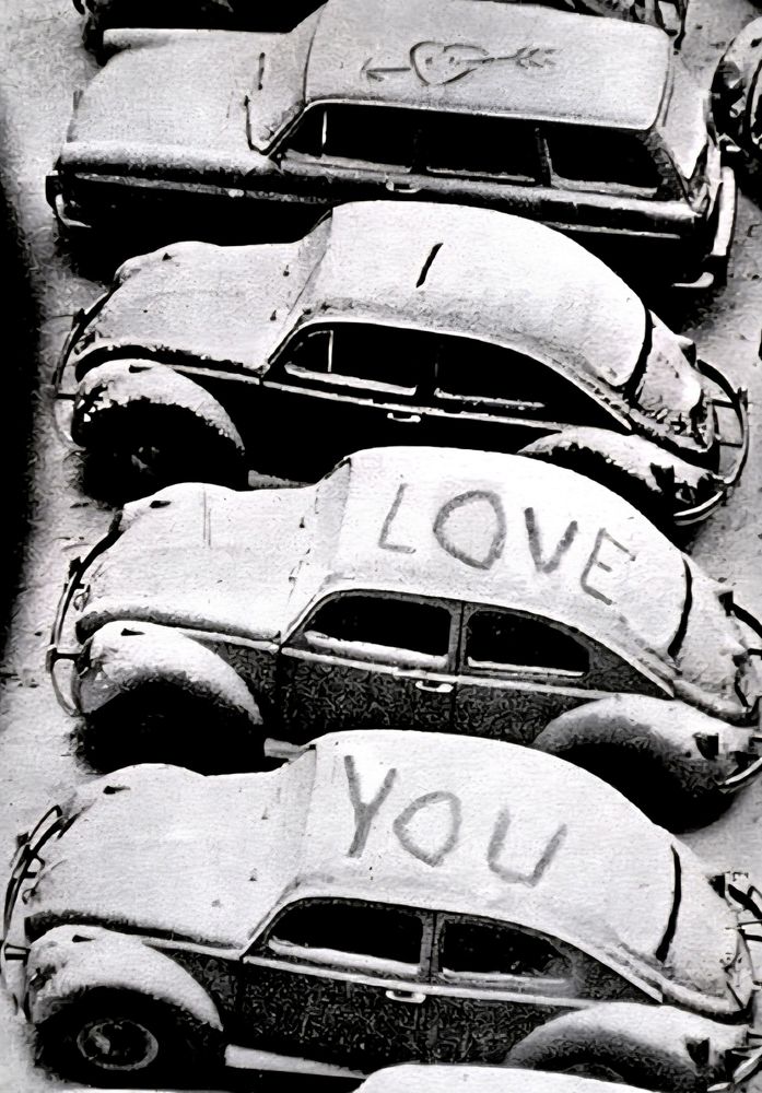 B&w photo with 4 cars (3 Volkswagen Beetle and?)