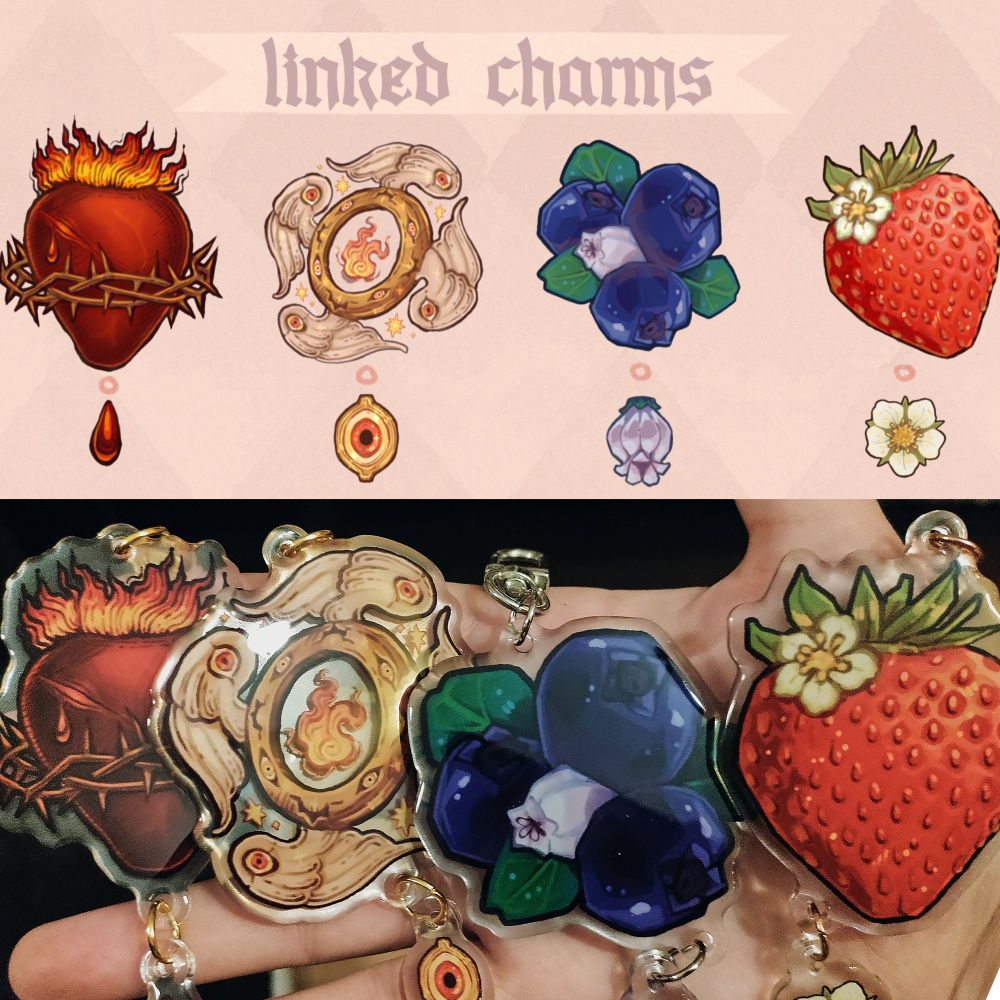 A collage image of four linked charms. Above is the digital illustrations. From left to right there is a sacred heart with a blood droplet. Then a wheel angel with an eye. Then three blueberries and a blueberry flower. Lastly one strawberry with a strawberry flower.
Below is an image of the same order in real life as epoxy charms. The blood droplet, eye, and two flowers are smaller, linked charms.
