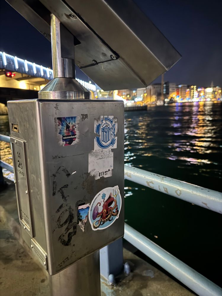 An octopolis sticker (not sure who put it there) on a view box in Istanbul. 