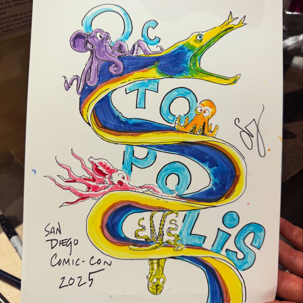 A pen and ink drawing of a group of cartoon octopuses clinging to a ribbon eels. Text: octopolis sam diego comic con 2025