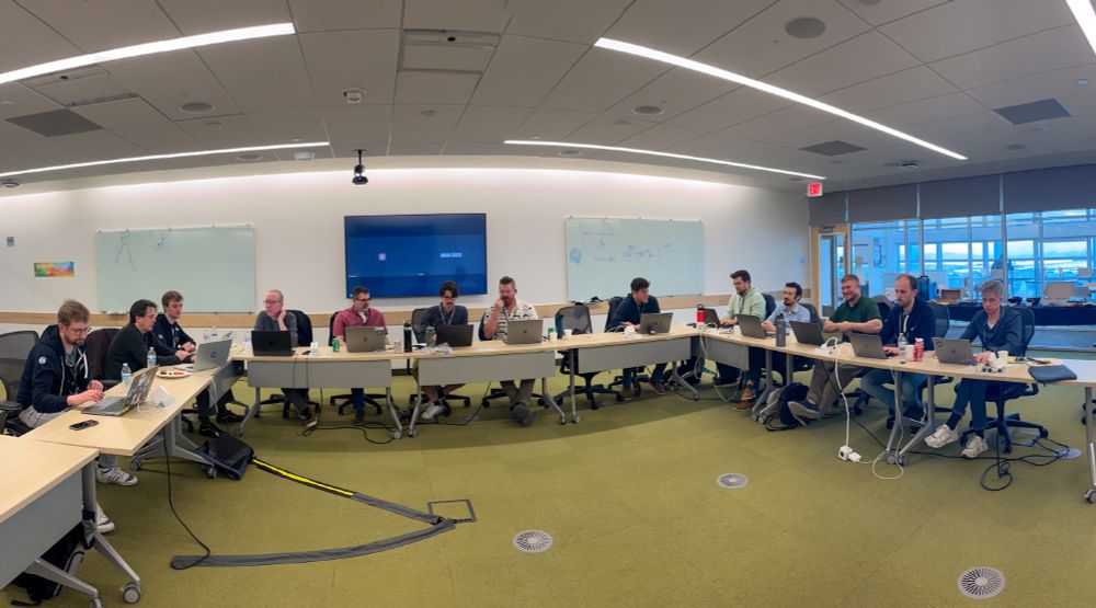 Men working around a U shaped table