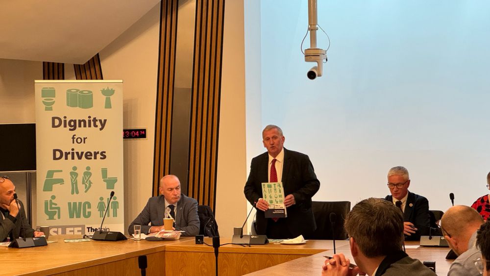 Alex Rowley holding the report and welcoming guests