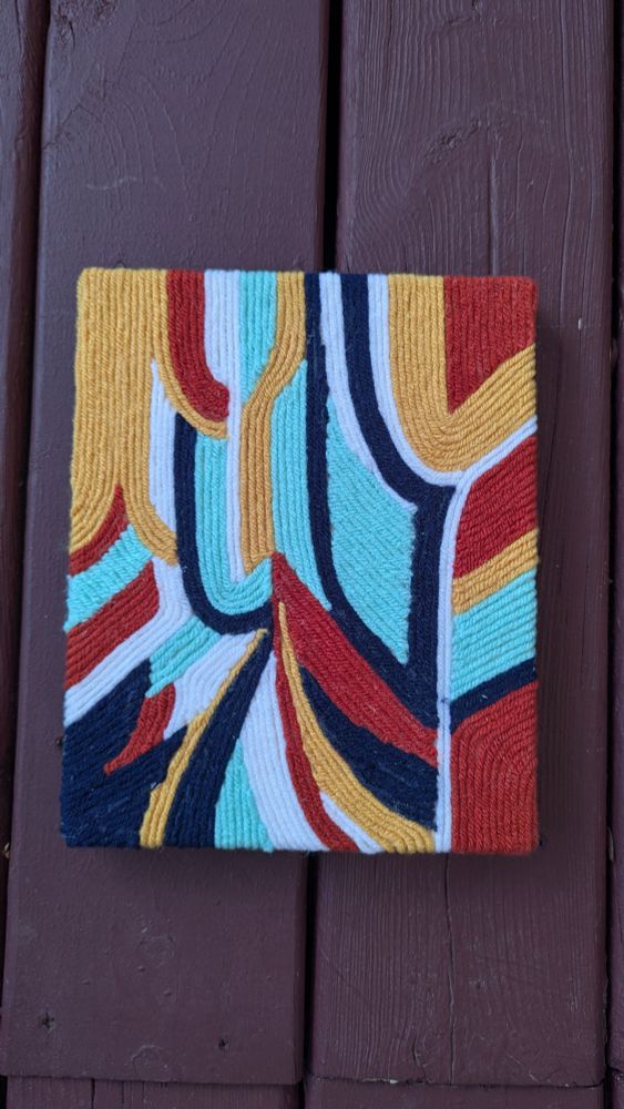 Coloured yarn on canvas. Geometric and abstract