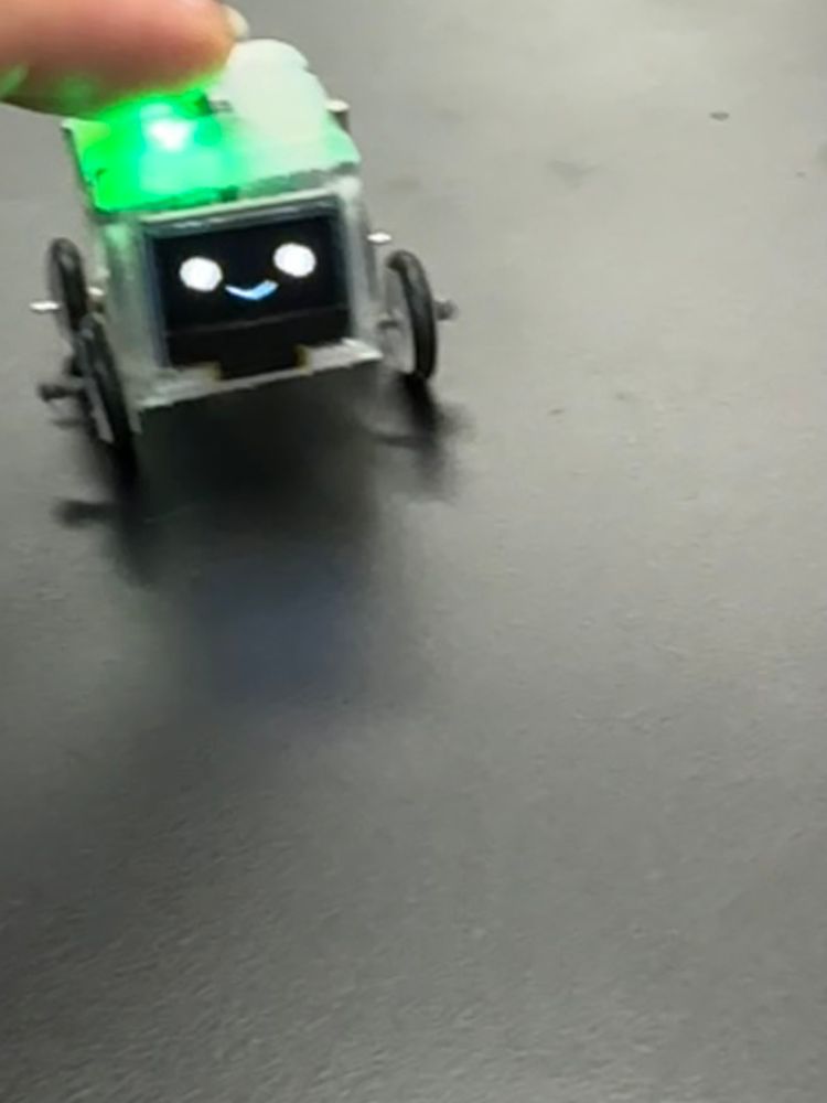 Mini robot displaying a smile.