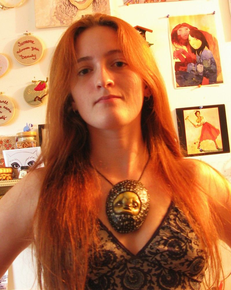 photograph of me with long red hair, wearing a Scott Radke pendant.