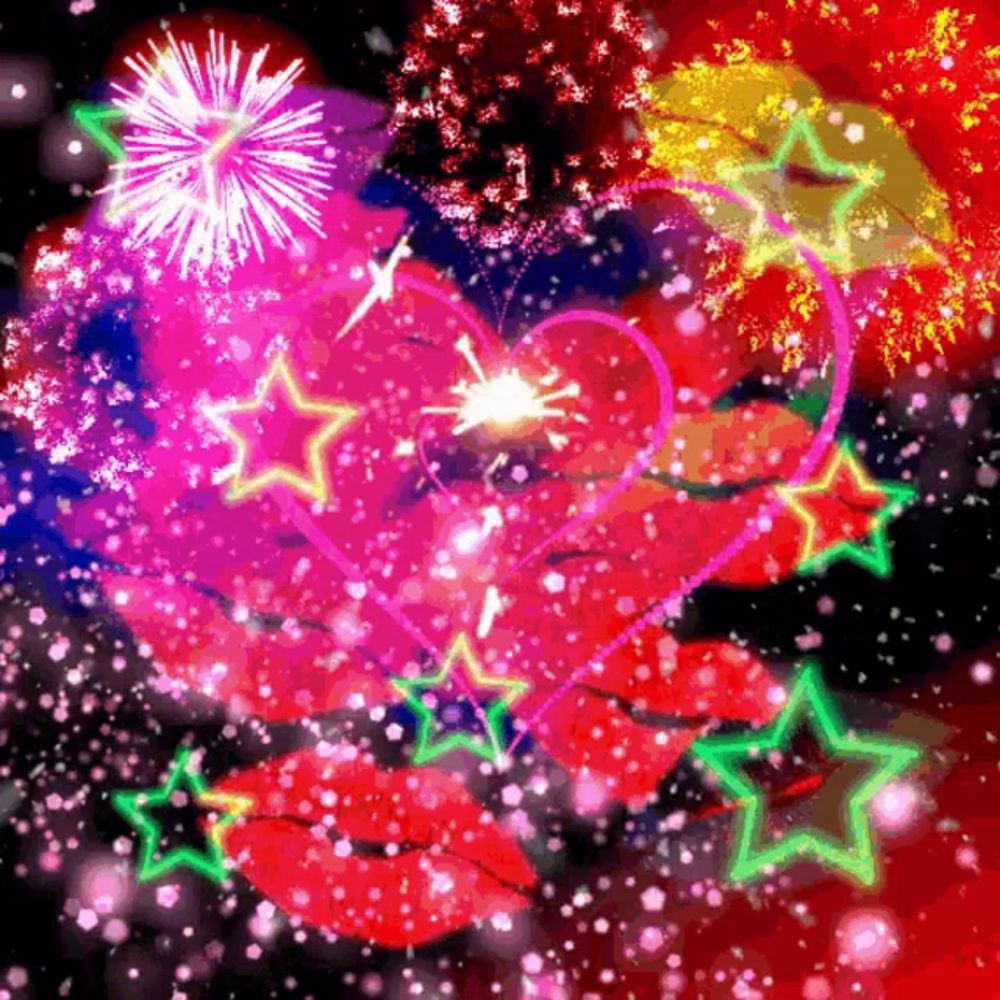 a colorful fireworks display with a heart and green stars