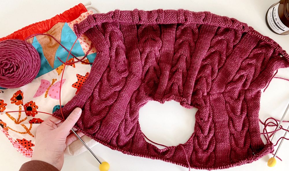 The start of a cabled sweater that’s basically a weird necklace at this point.