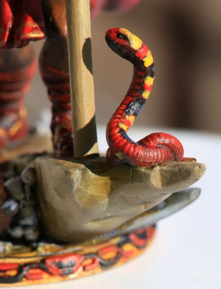 Heroforge figurine of an ElfQuest hero, small detail of a coral snake on a rock, red touches yellow. noAI