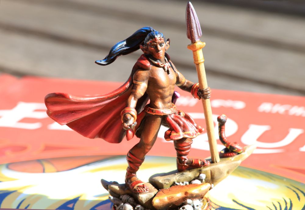 3d-printed and painted Rayek figurine standing on the cover of the new ElfQuest Original Quest re-issue. Quite heroic pose, but also a lot of seriousness within him, brooding and maybe melancholy.
