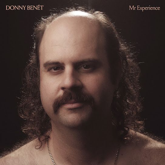 Album cover for Mr. Experience by Donny Benét

A bust photo of a middle aged man with a mustache and balding on top but long curly hair