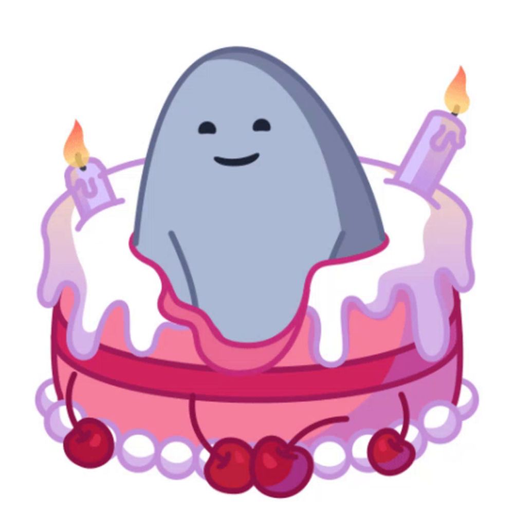 a cartoon drawing of a shark on a birthday cake with candles