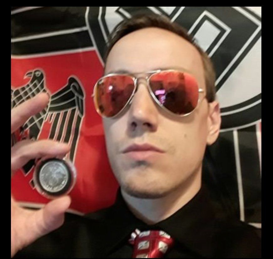Jeffrey Clark in front of a nazi flag