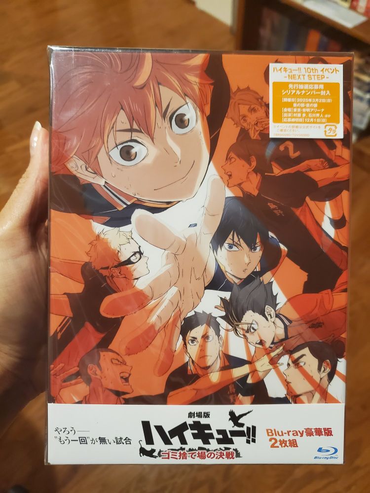 Me holding the DVD of the Haikyuu movie