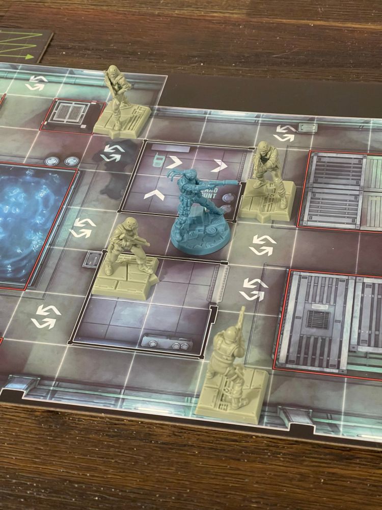 The Metal Gear Solid board game. Snake is surrounded with all escape routes covered by a guard.