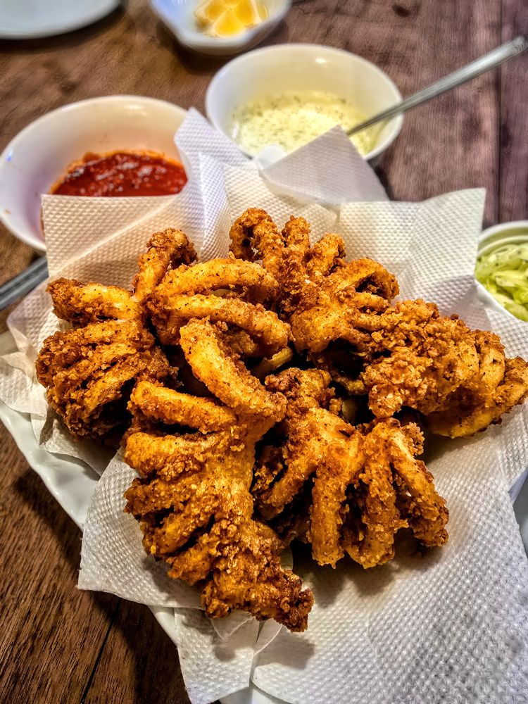 A big bowl of fried calamari. 