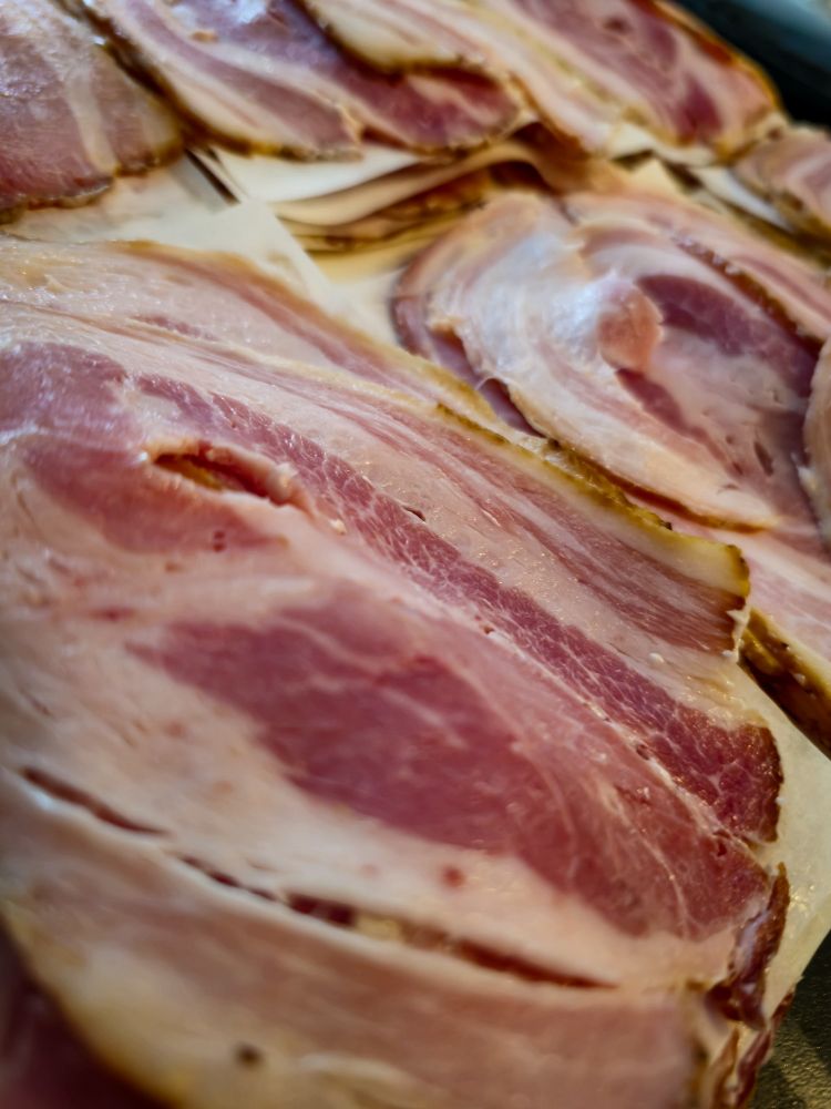 Freshly sliced homemade bacon. 