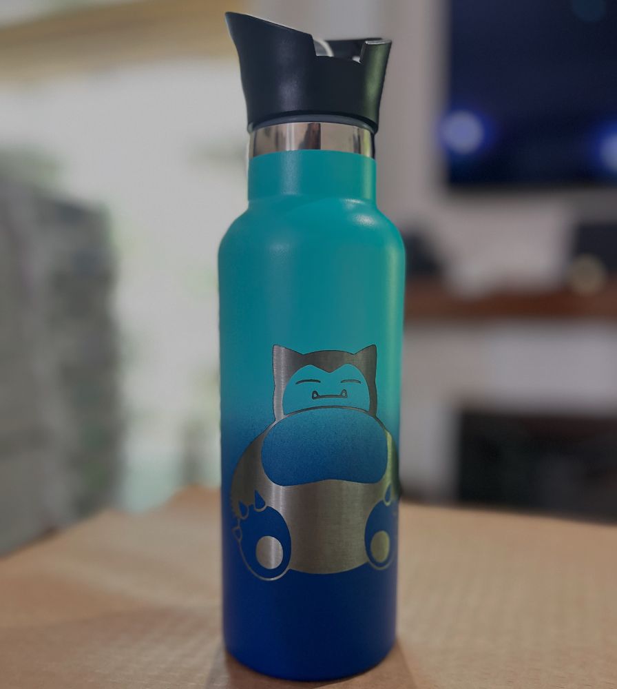 Laser engraved water bottle with a cute image engraved on it. The water bottle is two shades of blue