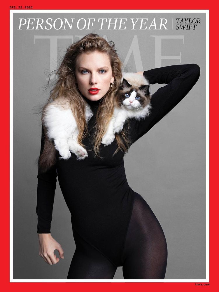 Cover photo of Taylor from the 2023 TIME magazine Person of the Year photo shoot: looking fierce in a black body suit and tights, wavy hair, red lips, her cat Olivia draped across her shoulders