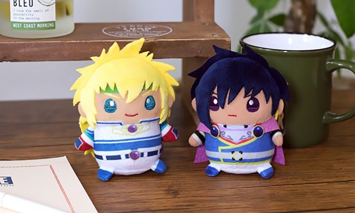 An image of Stahn Aileron and Leon Magnus plushies. They are sitting on a table.