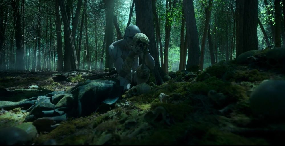 The Creature examining a skull, Frankenstein (2025)