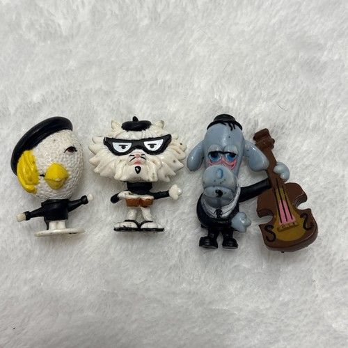 From left Chicky Baby figurine, 
Cool Cat with bongos figurine, Dirty Dog with upright bass figurine