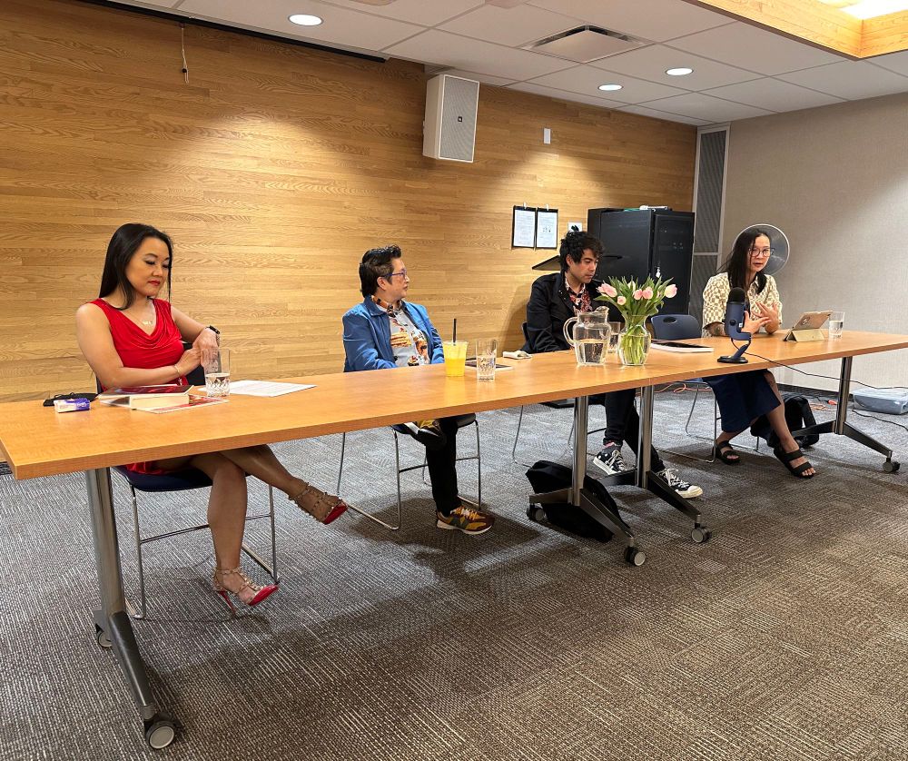 Catherine Lewis, Candie Tanaka, Kawika Guillermo, and Isabella Wang seated behind a long table for a panel discussion