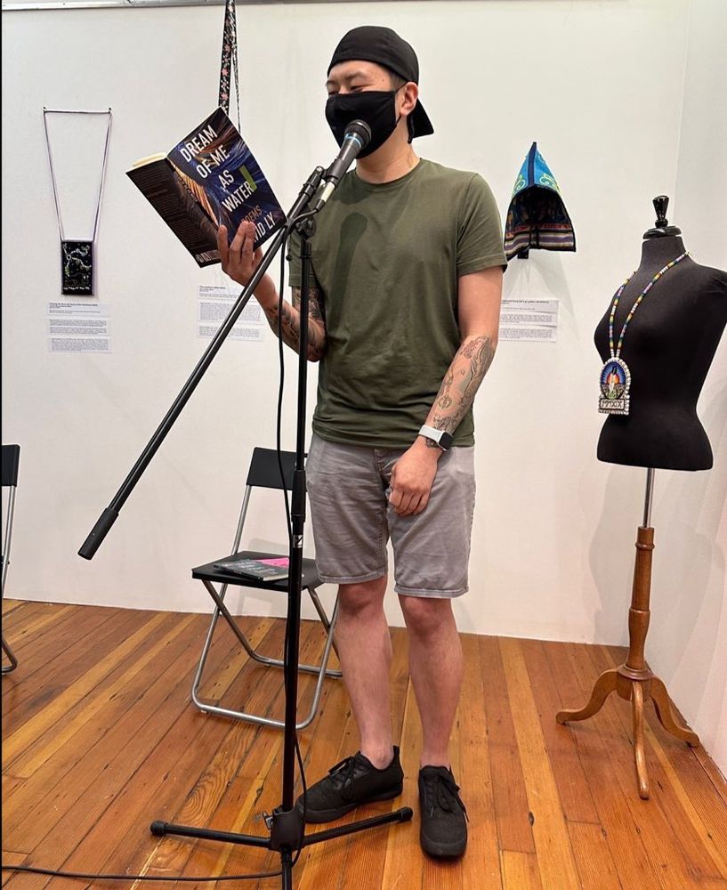 David Ly up at the mic, reading from his book DREAM OF ME AS WATER