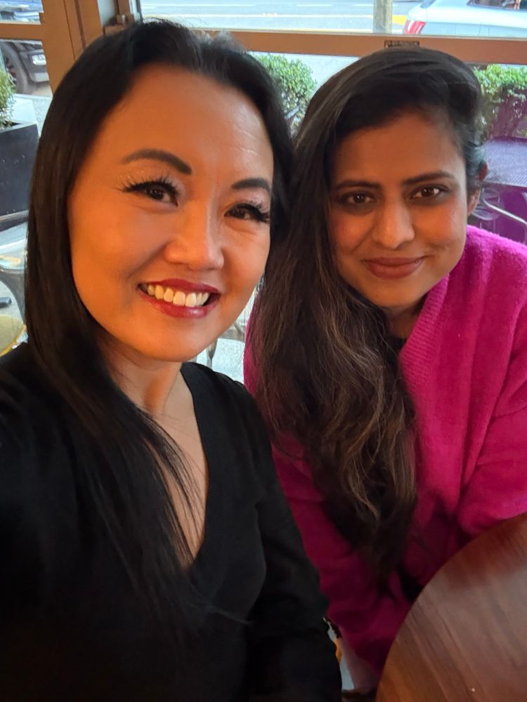 Selfie of Catherine Lewis with Prachi Kamble at a café table