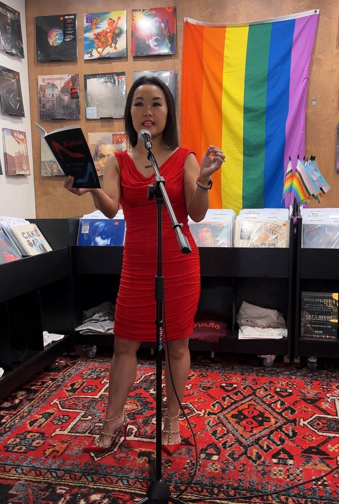 Catherine Lewis up at the mic, reading from her chapbook ZIPLESS