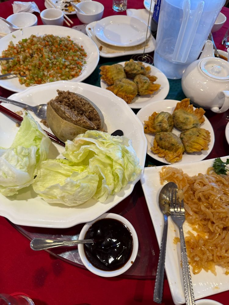 Haggis lettuce wrap, deep-fried haggis wonton dumplings, and jellyfish on serving platters