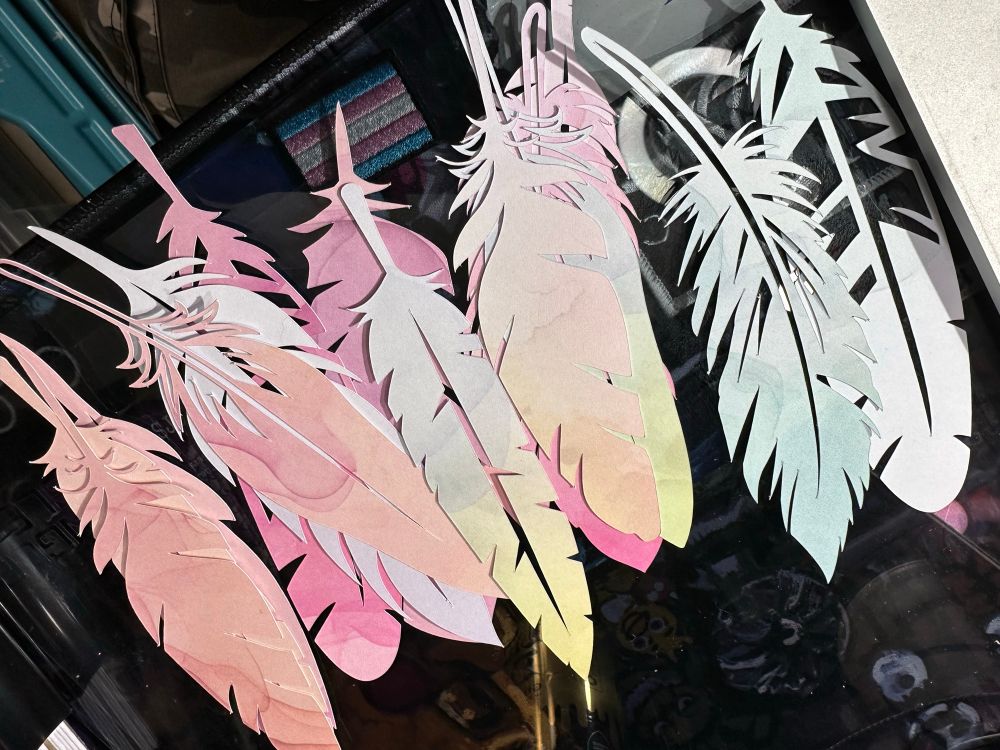 Many feathers. But they’re made of paper. These are bookmarks and are made with off cuts. 