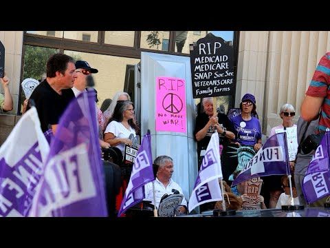Protesters hold 'die in' outside Joni Ernst's Davenport office