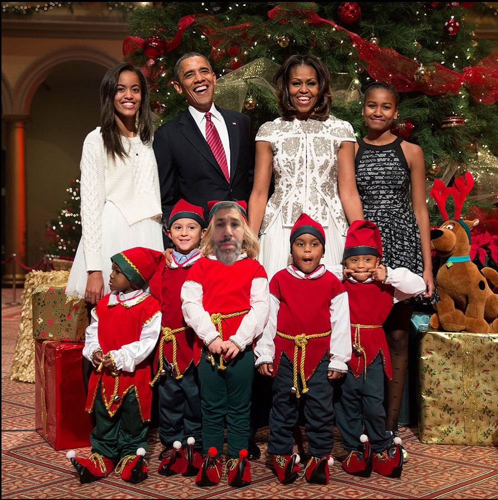 a picture of the Obama family in front of a huge Christmas tree with my face badly photoshopped over the face of a small child, dressed like an elf.
