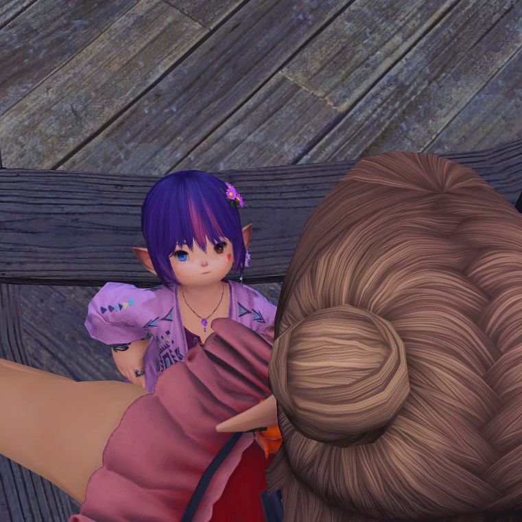 A cute lalafell looking up at their elezen girlfriend