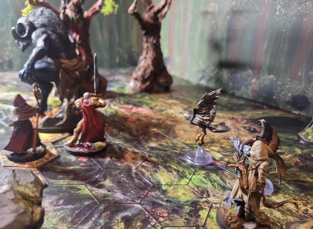 A tabletop miniatures game in action, the heroes have broken the monster's resolve. "It's afraid!"