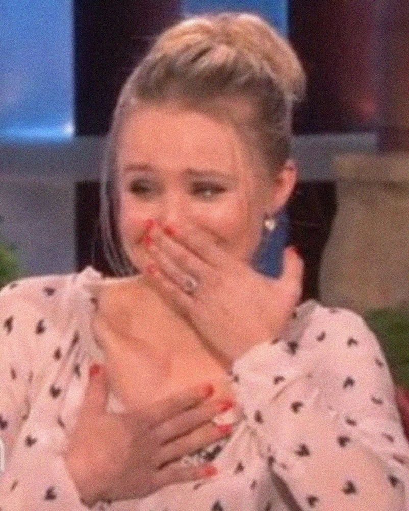 Kristen Bell happy clutching her chest sobbing 