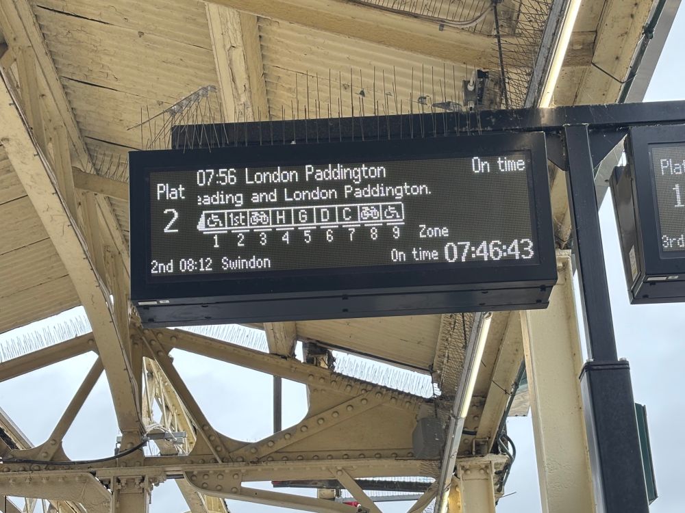 Platform sign showing 07:56 to London 