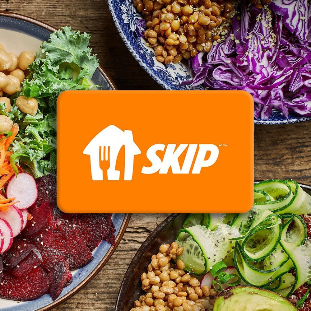 Orange Skip gift card with white text, superimposed over platters of colourful vegetarian food