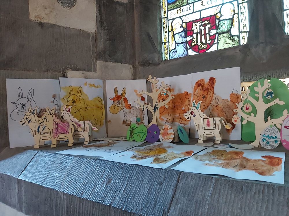 Paintings by children of donkeys - paint made of spices
Wooden trees with Easter eggs hanging from them
Wooden donkey pencil pots coloured in by children