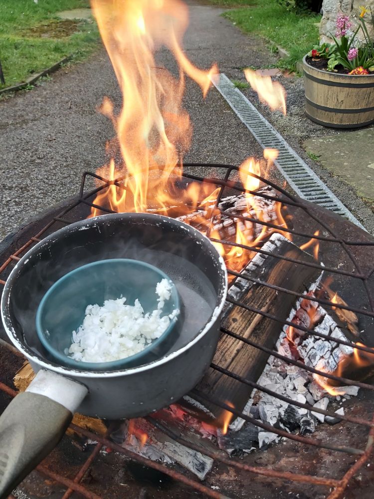 Ingredients in saucepan over fire