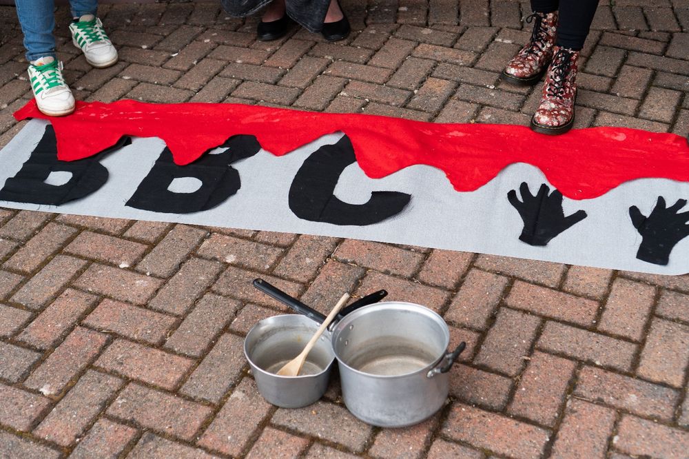 Banner with BBC on it covered in fake blood