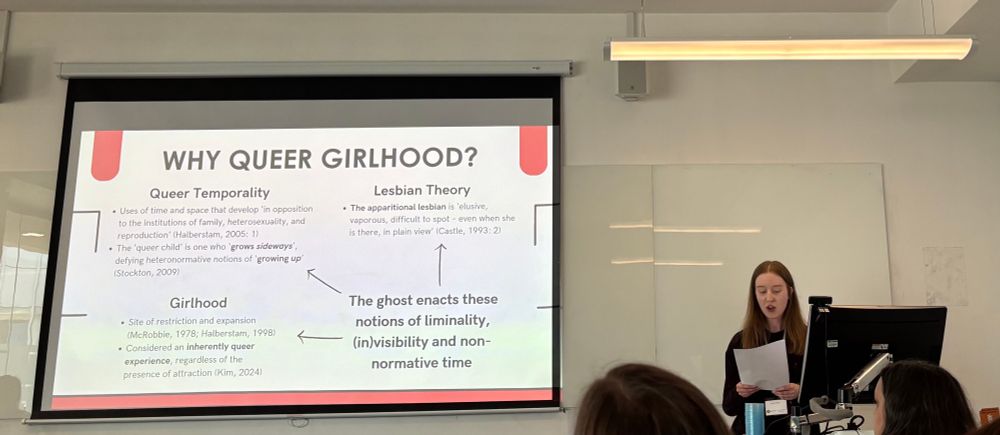 Woman giving a conference paper 