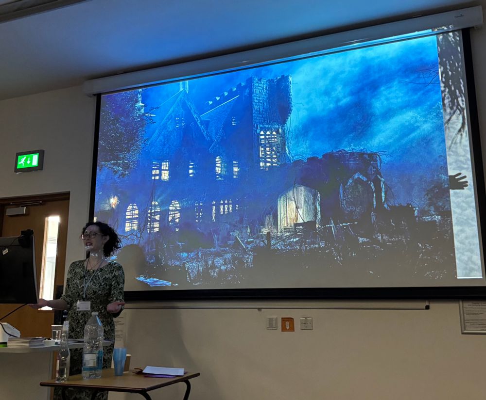 Woman giving lecture in front of screen