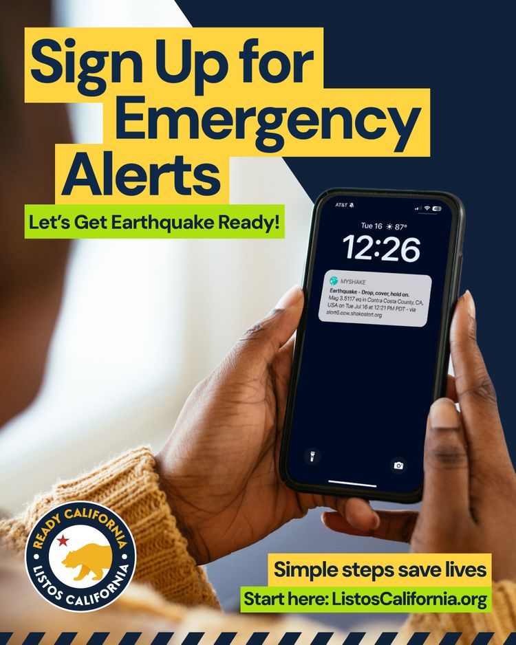 Promotional poster by Listos California encouraging sign-ups for emergency alerts. A person is shown holding a smartphone displaying an earthquake alert message. Text reads 'Sign Up for Emergency Alerts' and 'Let's Get Earthquake Ready!' with the website link 'ListosCalifornia.org' at the bottom.
