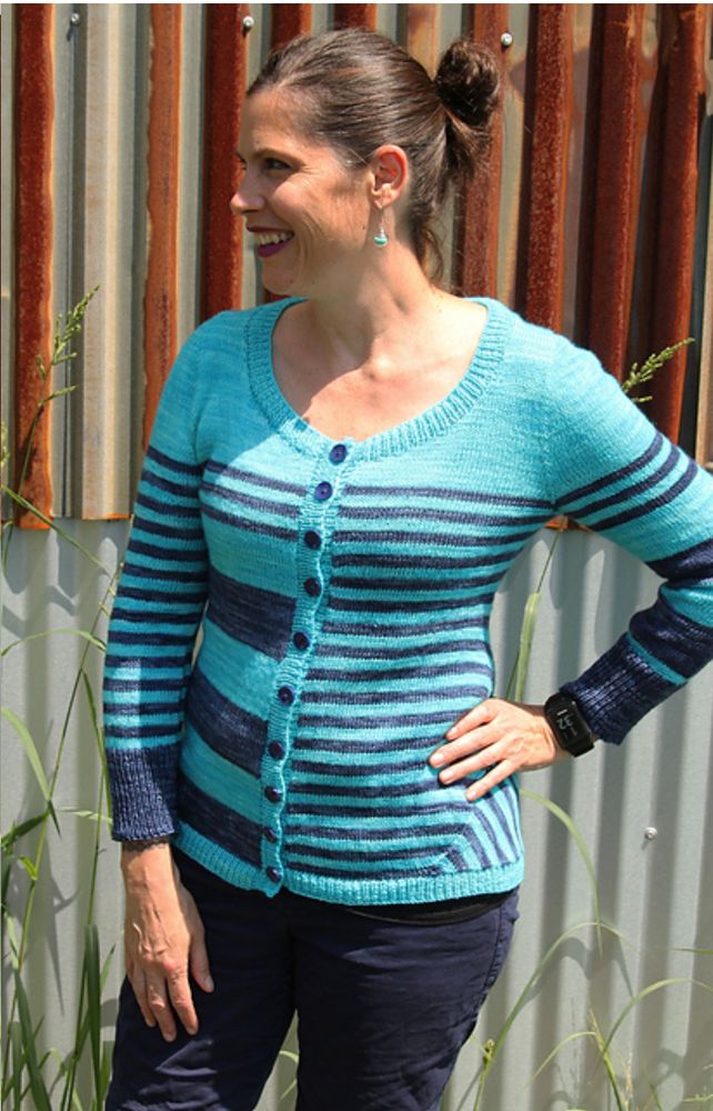 Front of crazy stripes cardigan in front of striped shed 