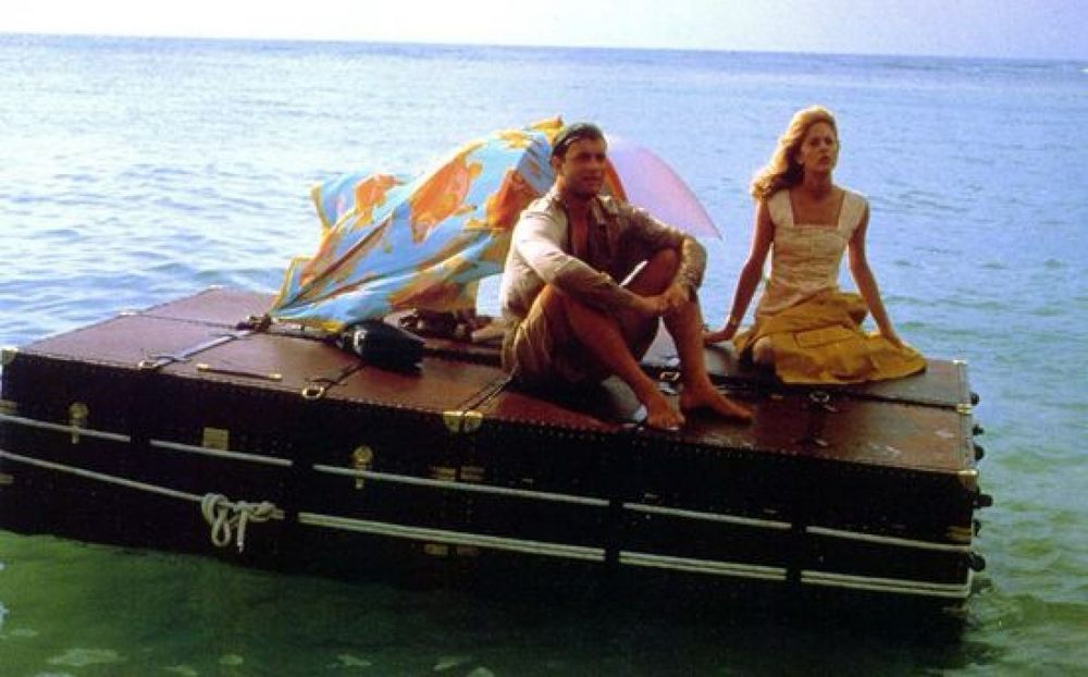 Joe vs. The Volcano. Joe and Patricia sit on the trunk raft and watch the volcano erupt