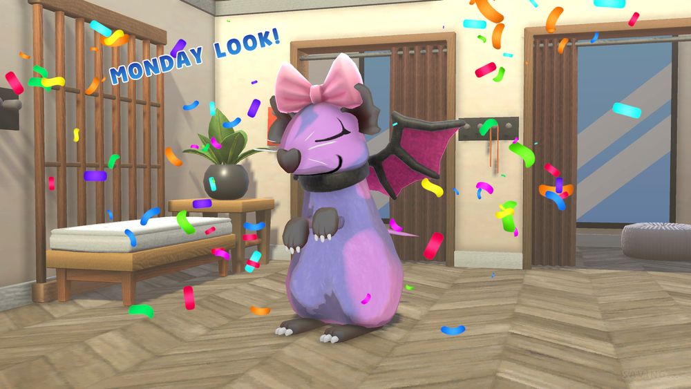 Purple and pink colored cartoon mouse wearing a pink bow, with fuschia bat wings standing in a modern-looking room. The mouse is standing up with it's eyes closed and looks happy. The mouse has a heart-shaped black nose. The term "Monday look!" and confetti surround the mouse.