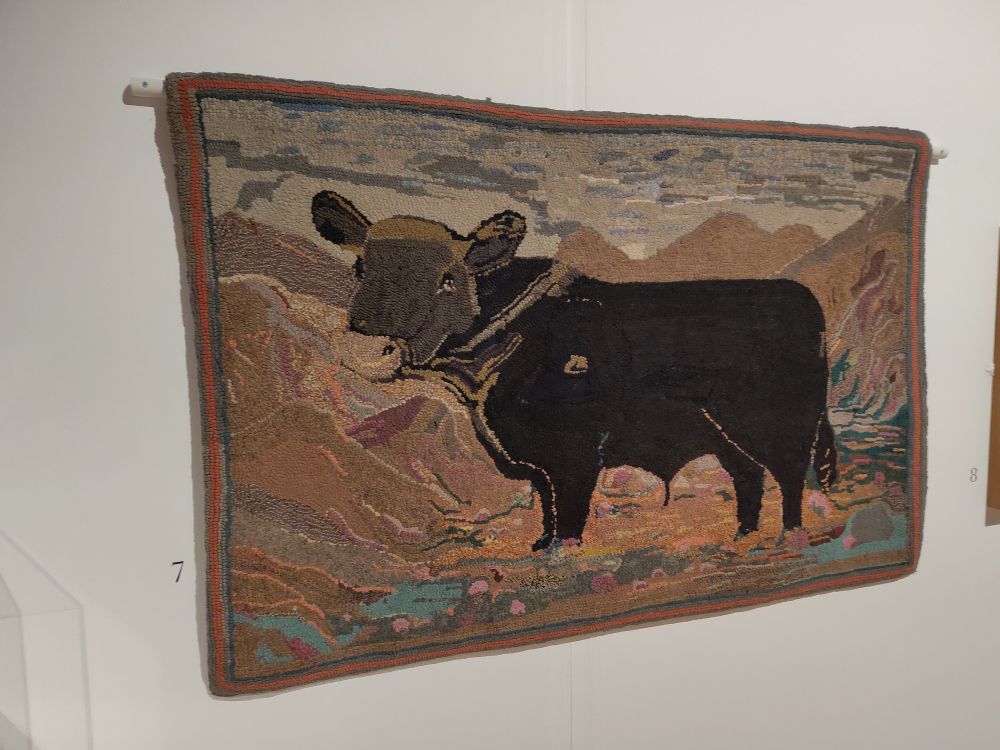 Rug featuring a cow standing in the Cumbrian fells