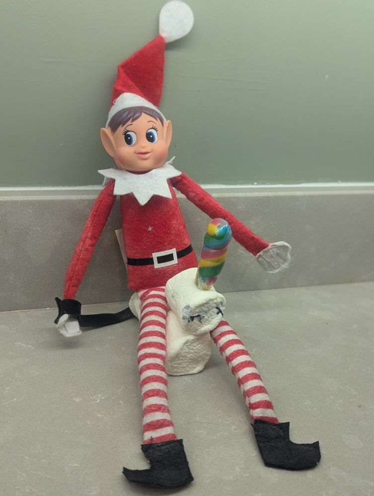 Elf on shelf astride a marshmallow unicorn